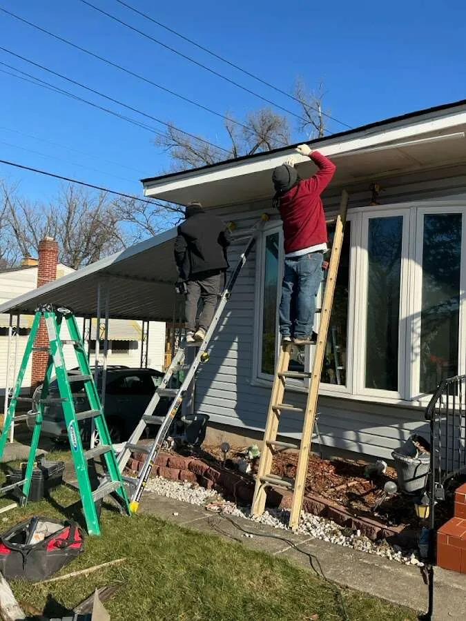 Restoration crew performing exterior repair in Fayetteville